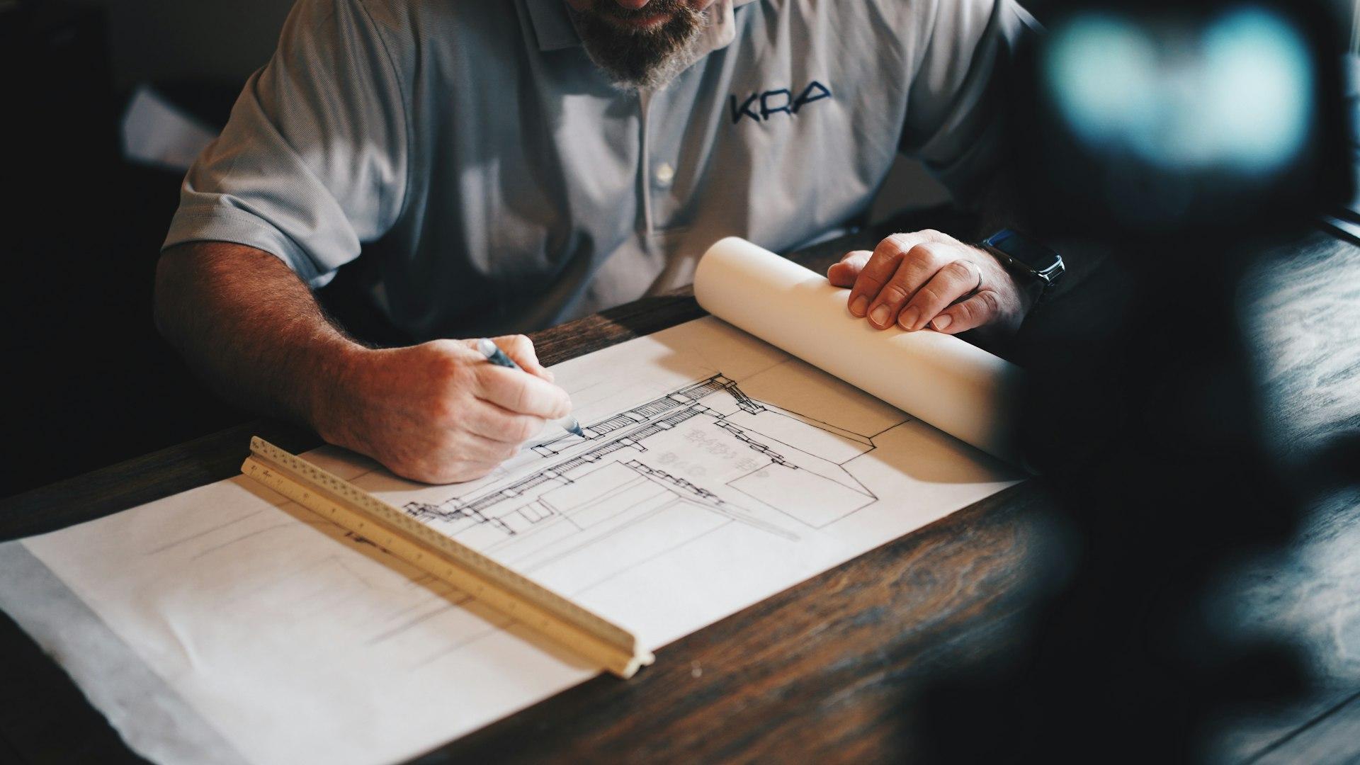 Architect drawing a building floor plan
